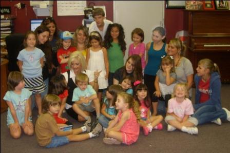 Susan Mele as a child in class with other students 